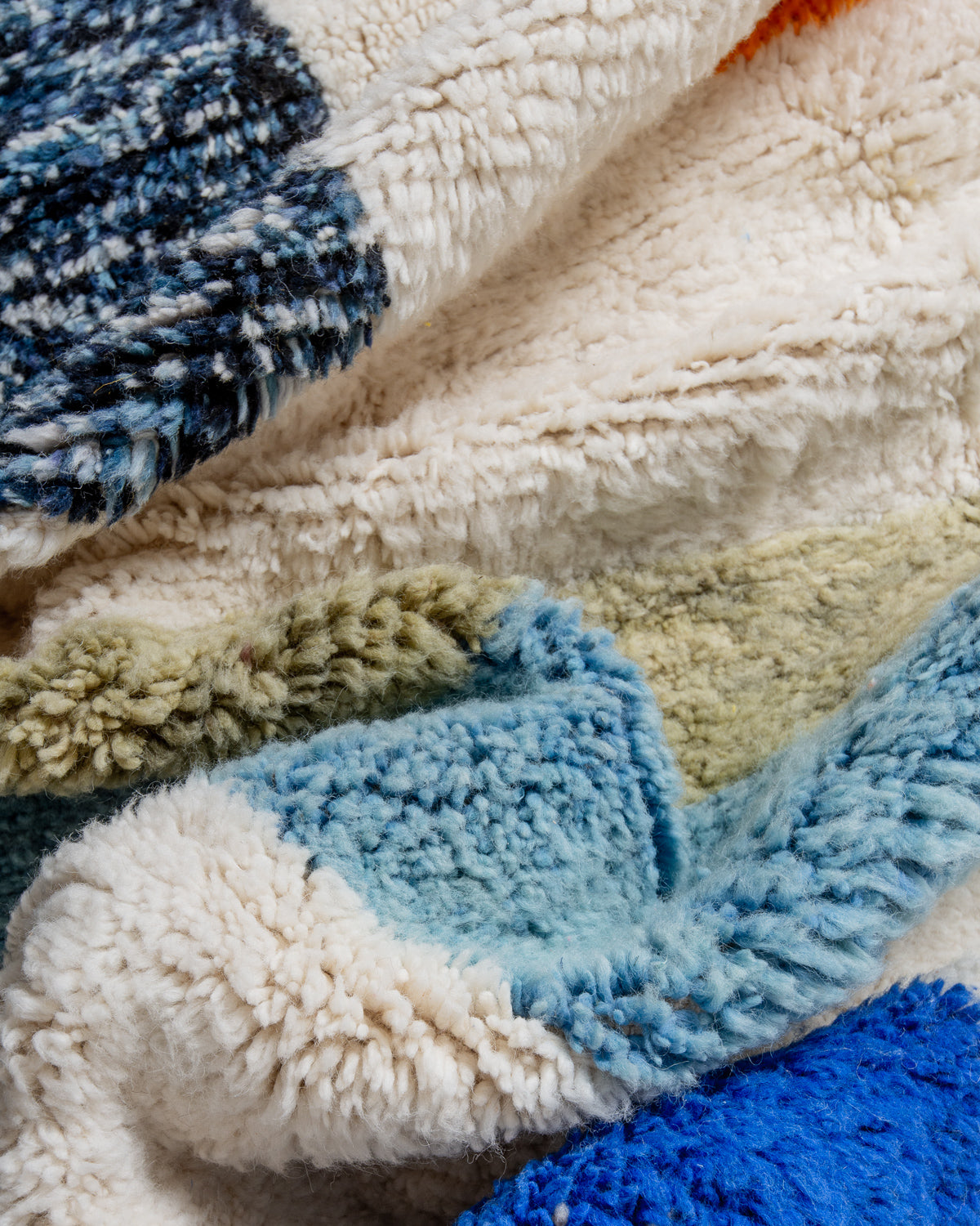 Modern, designer, handcrafted Berber rug from Morocco. Beniourain carpet with beautiful colours and patterns and fluffy wool texture.